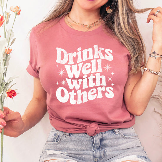 Drinks Well With Others funny graphic tee for women in Mauve, detail view