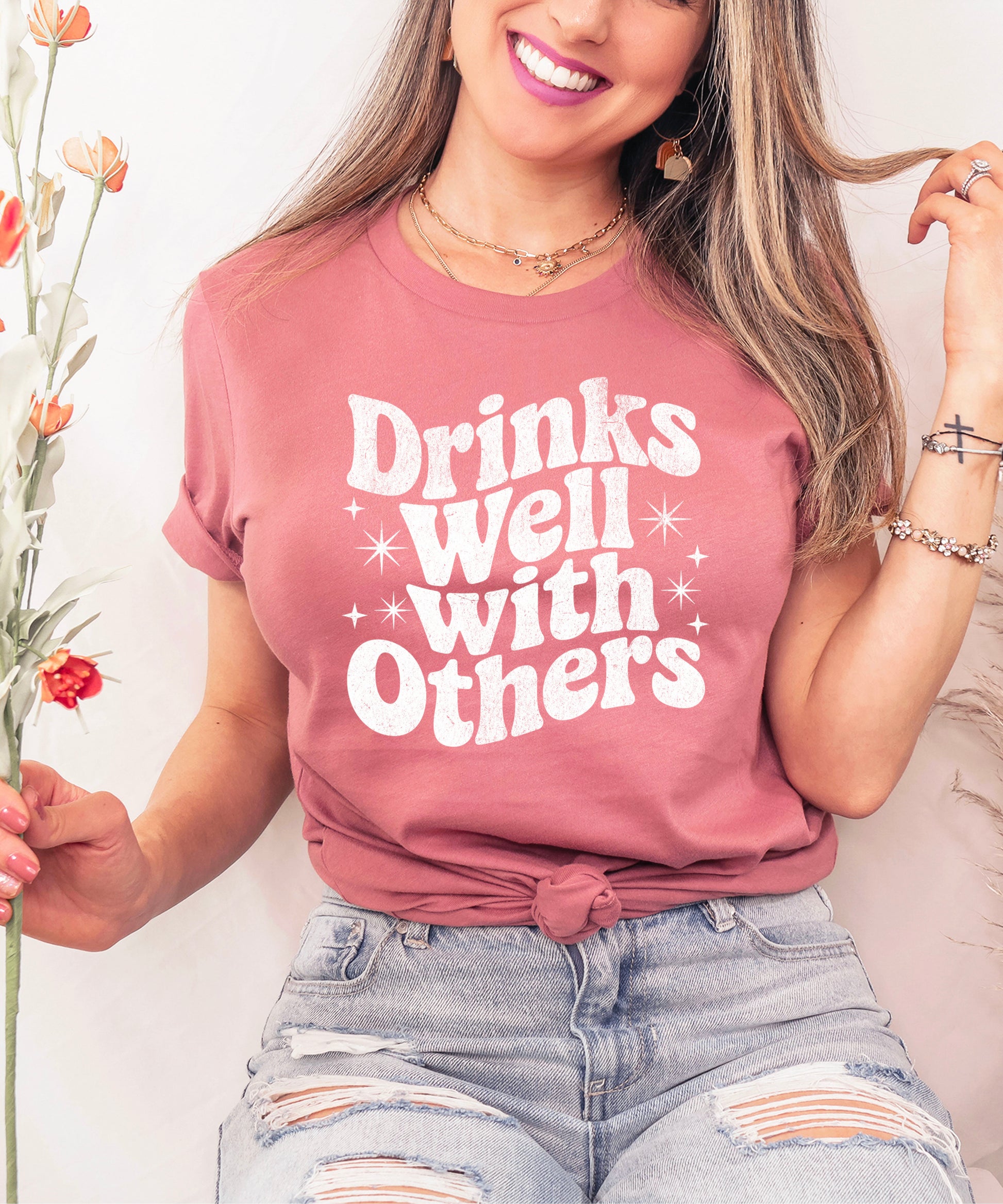 Drinks Well With Others funny graphic tee for women in Mauve, detail view