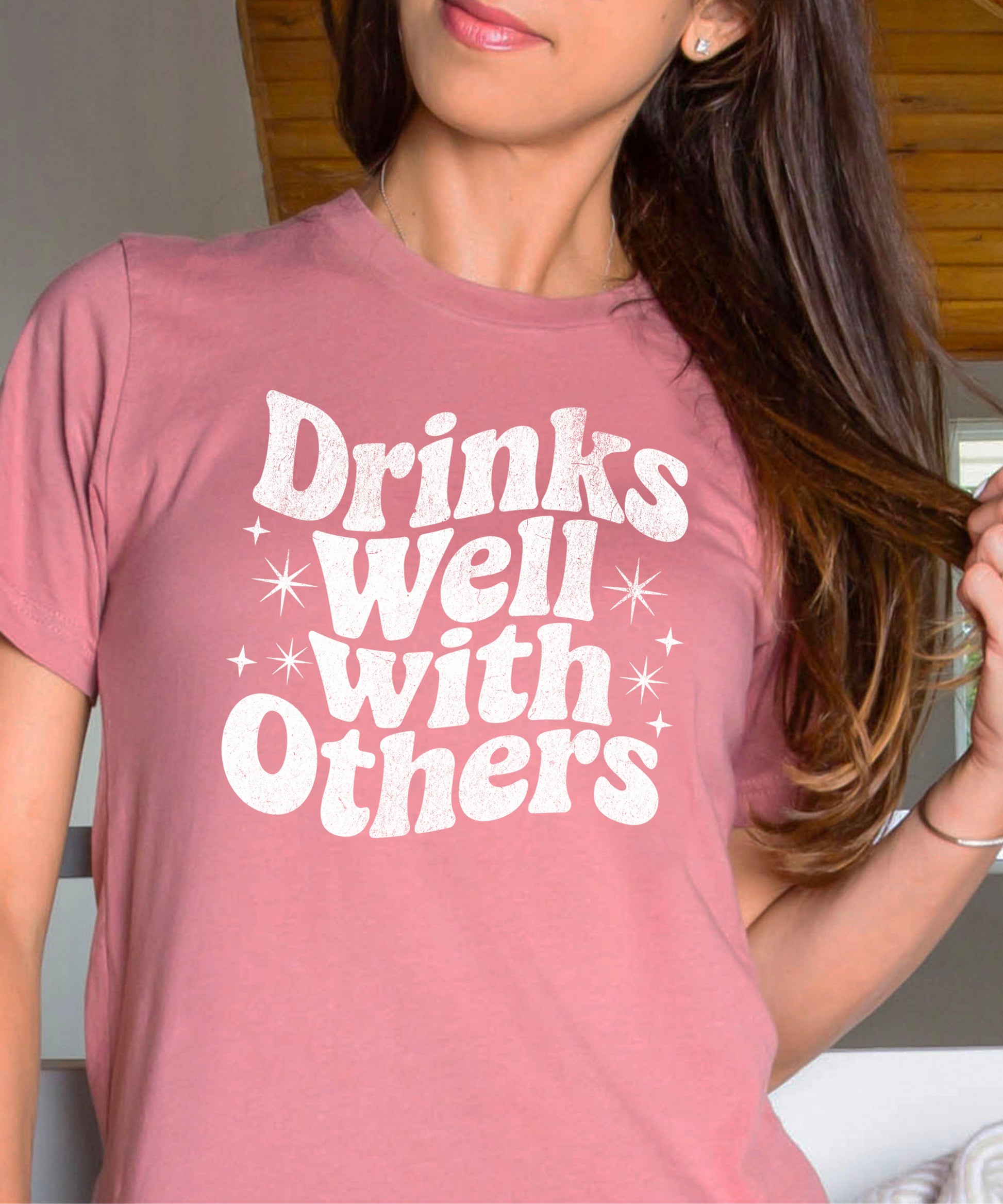 Drinks Well With Others funny graphic tee for women in Mauve, back view