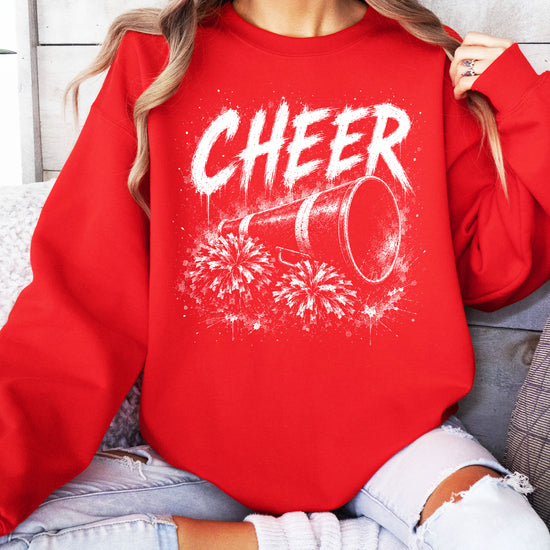 Red cheerleader sweatshirt styled on a model, showing the relaxed crewneck fit