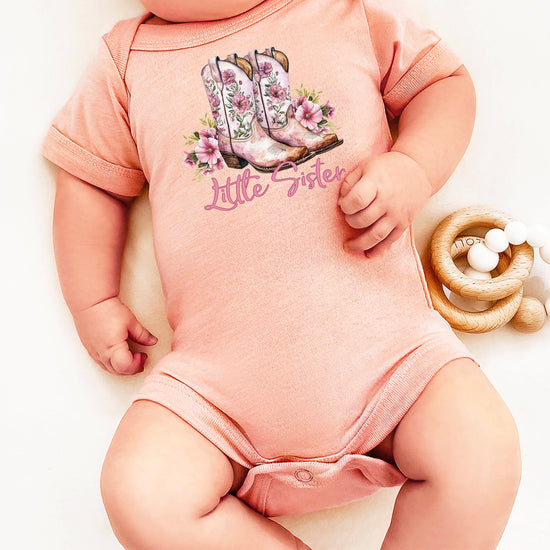 Peach Little Sister bodysuit, lifestyle shot