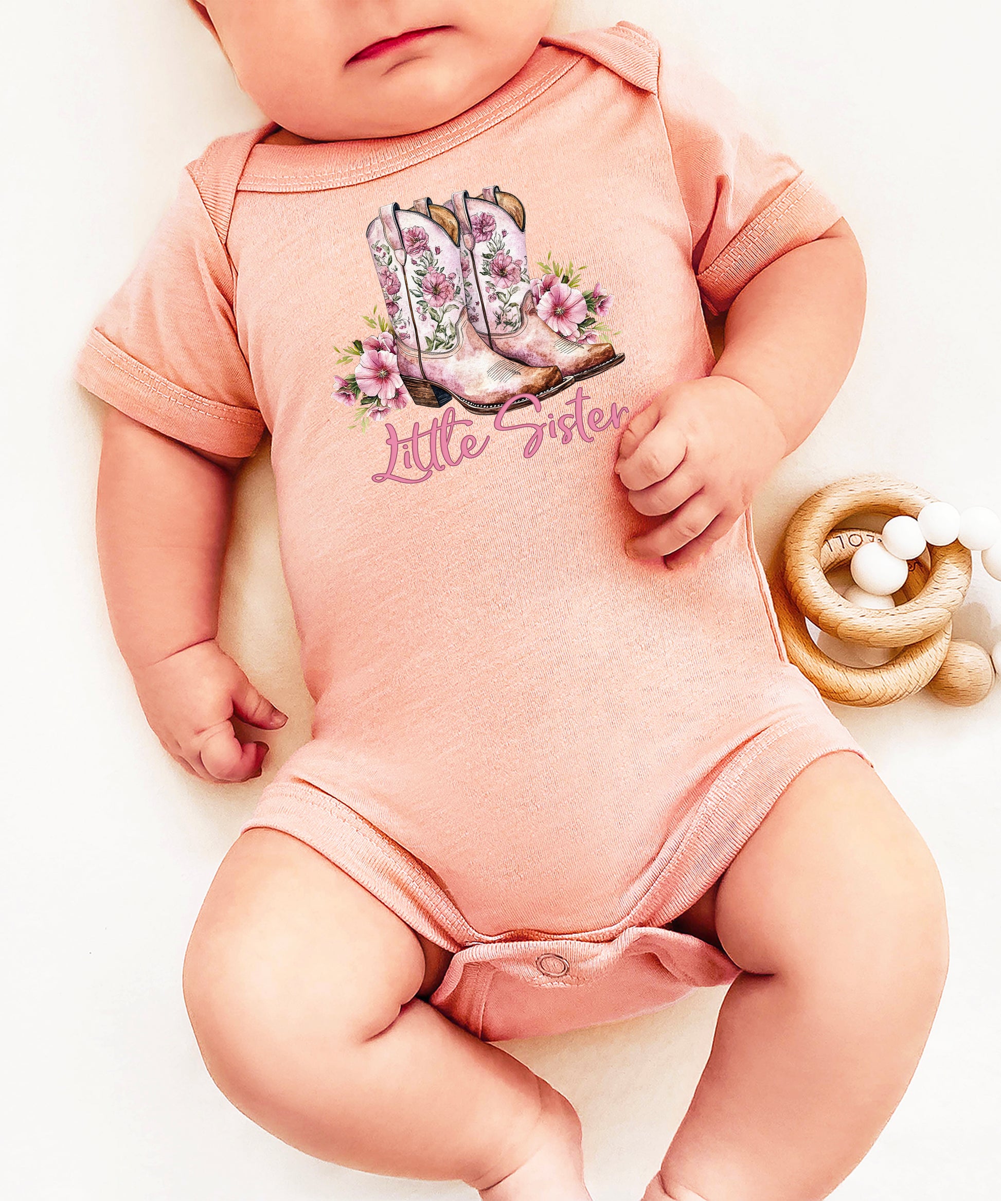 Peach Little Sister bodysuit, lifestyle shot