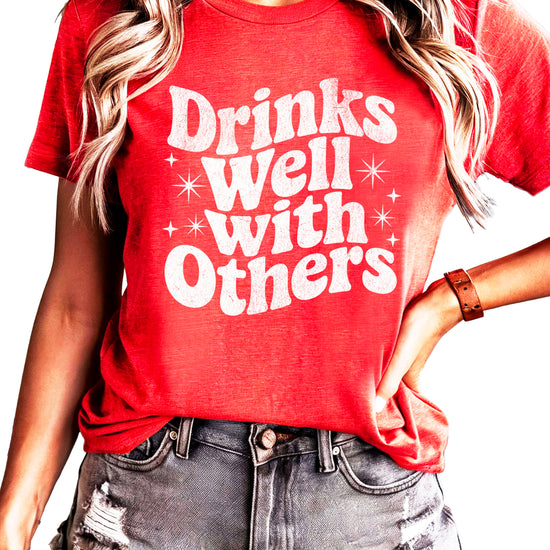 Drinks Well With Others funny graphic tee for women in Vintage Red, detail view