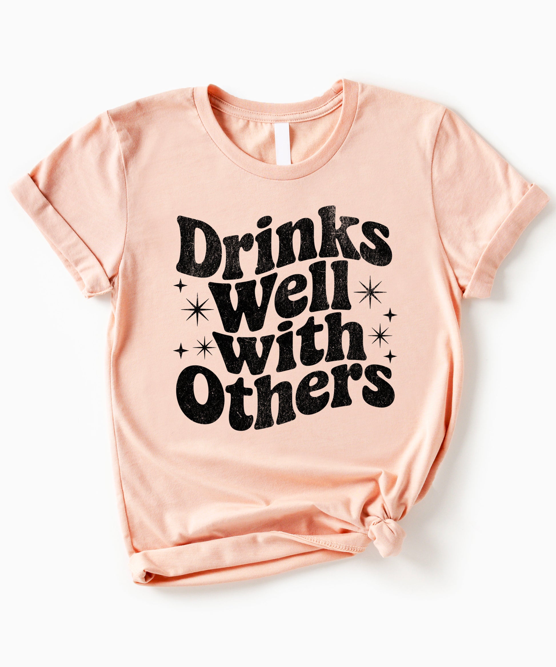 Drinks Well With Others funny graphic tee for women in Peach, lifestyle view