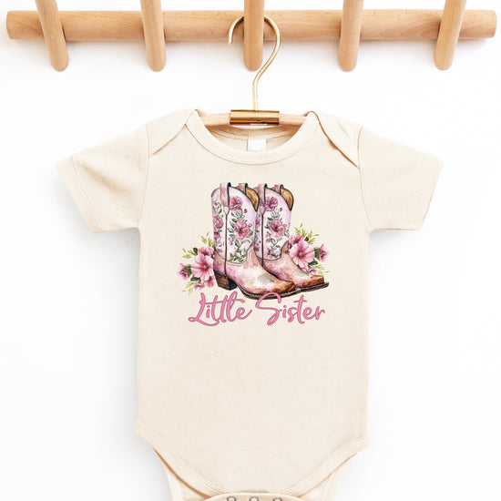 Natural Little Sister bodysuit, styled flat lay