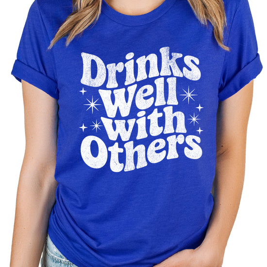 Drinks Well With Others funny graphic tee for women in Vintage Royal, front view