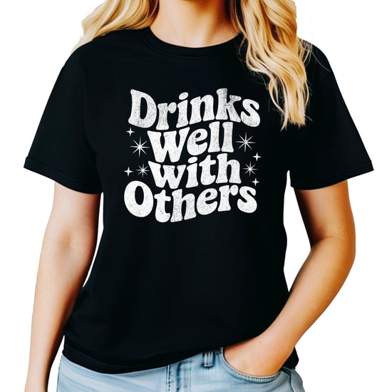 Drinks Well With Others funny graphic tee for women in Black, back view
