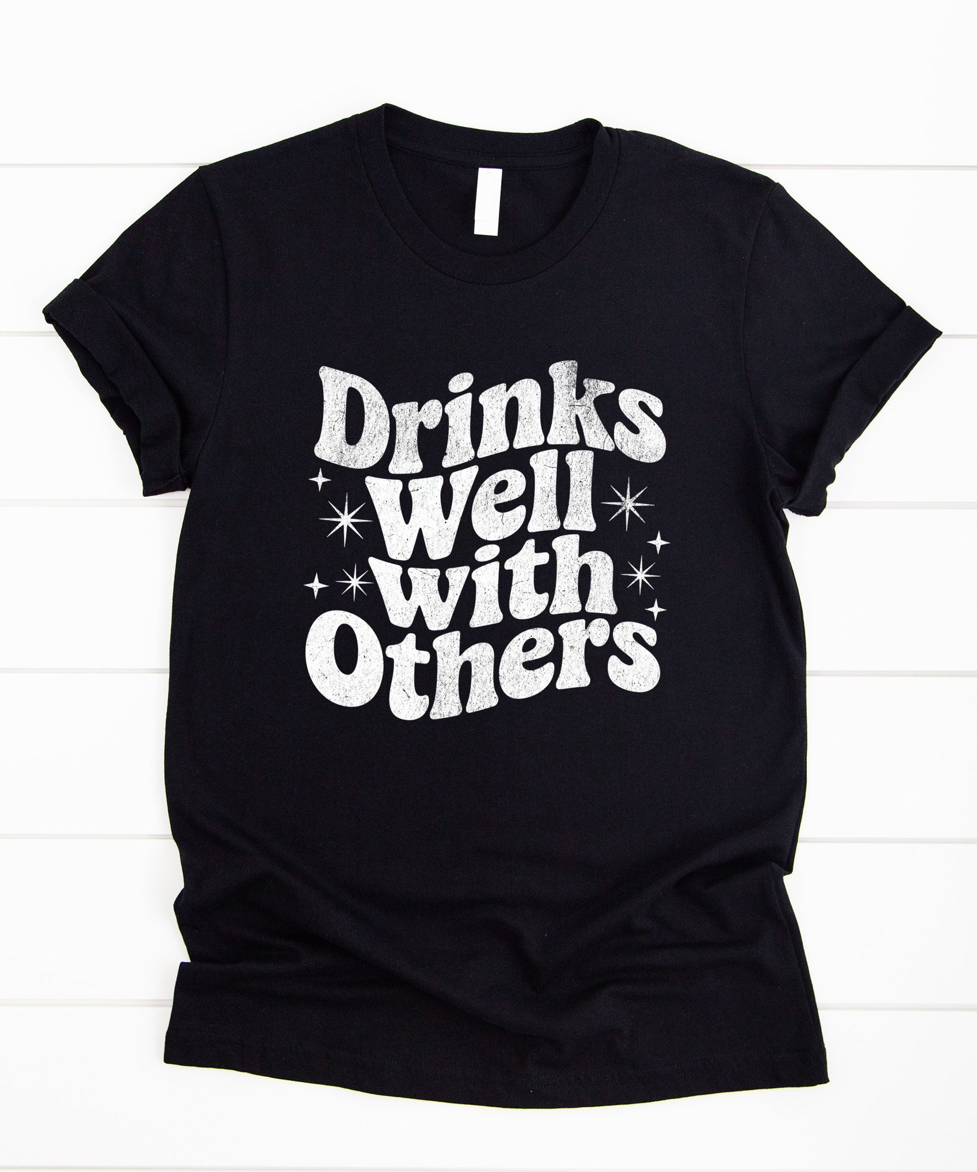 Drinks Well With Others funny graphic tee for women in Black, lifestyle view