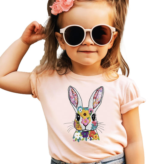 Women's Easter bunny shirt styled with jeans showing relaxed fit and spring design