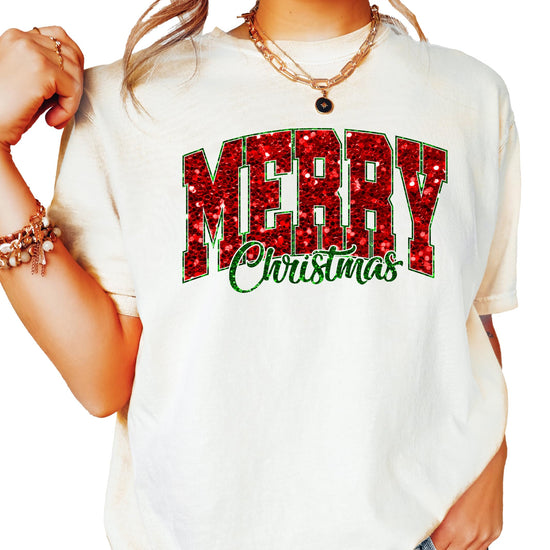 Close-up of bold faux glitter Merry Christmas graphic in red and green on seafoam tee
