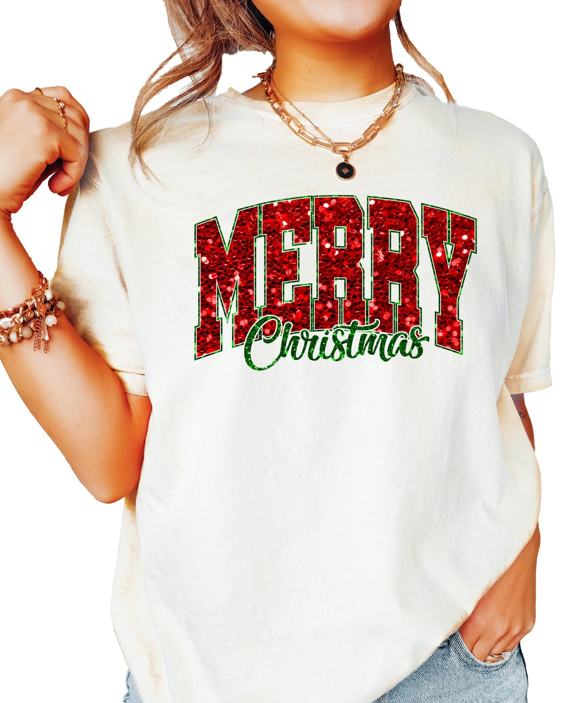 Close-up of bold faux glitter Merry Christmas graphic in red and green on seafoam tee