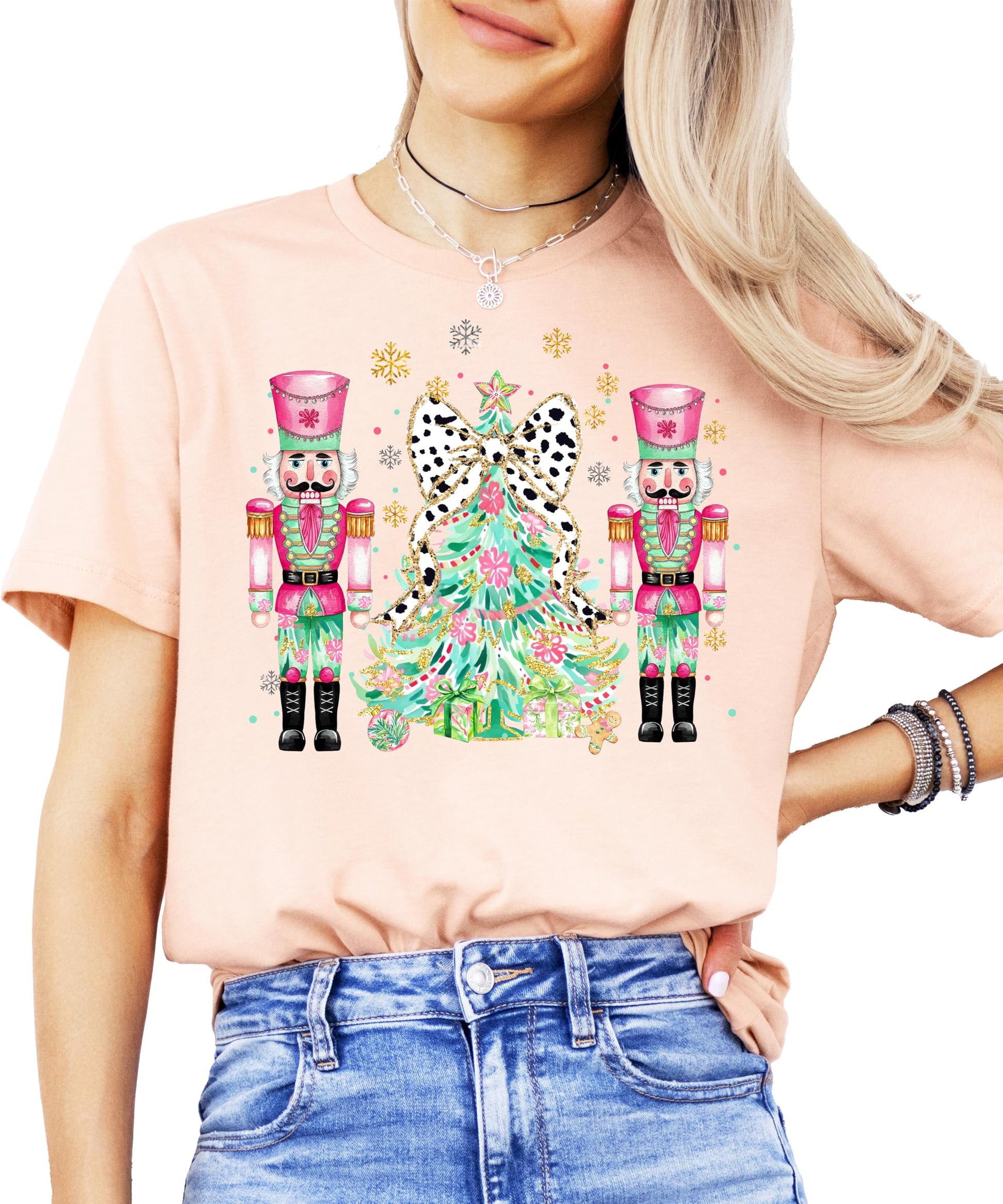 Youth girls wearing a peach Christmas nutcracker graphic tee for the holiday season