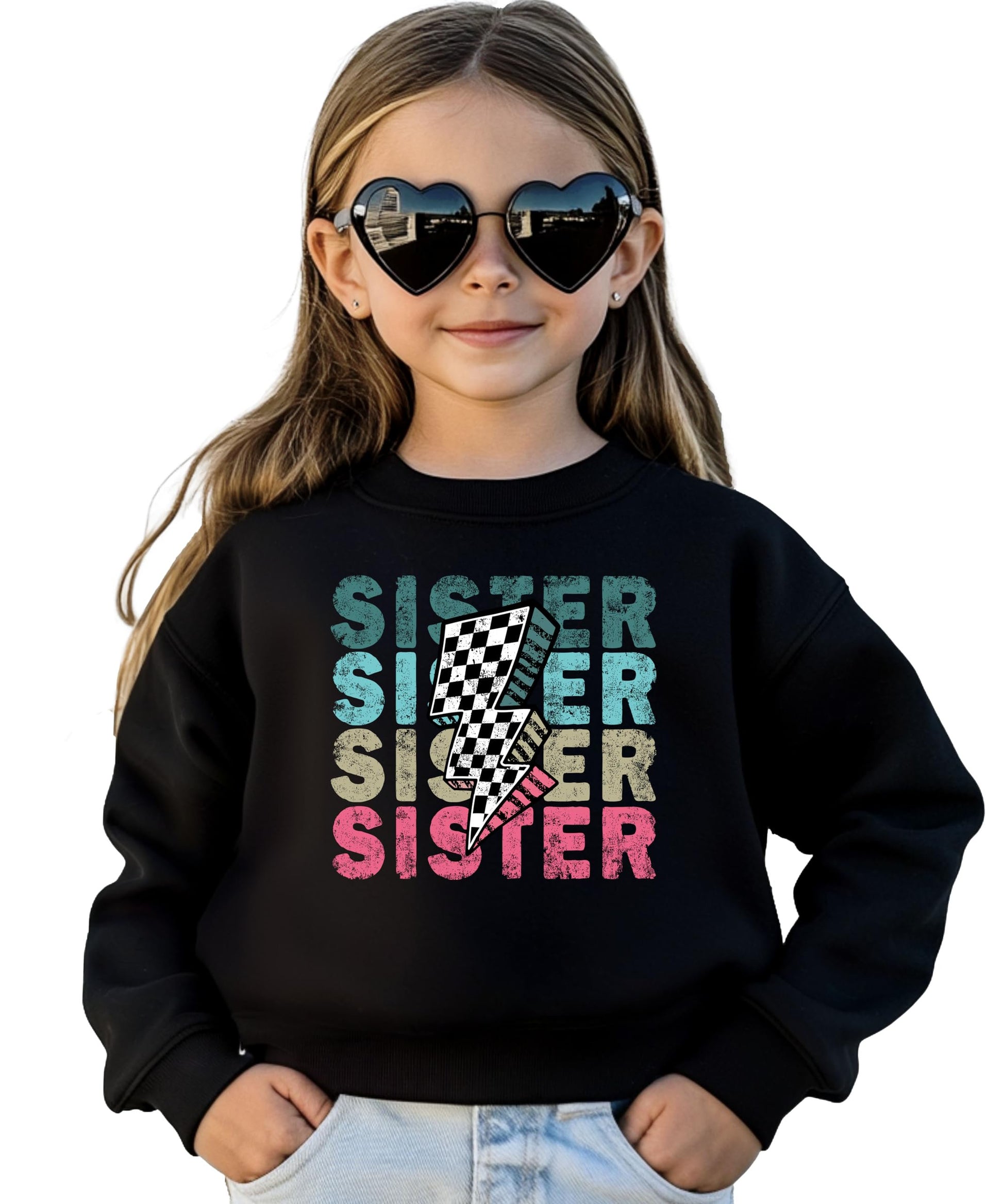 Close-up of colorful SISTER lightning bolt graphic print on pink youth sweatshirt
