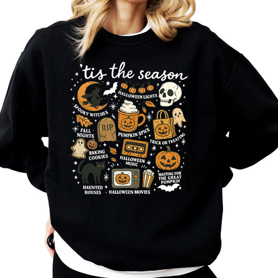 Close-up detail of Halloween pumpkin and ghost print design on gray sweatshirt