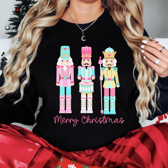 Christmas themed pullover with adorable pastel nutcracker illustration and holiday greetings