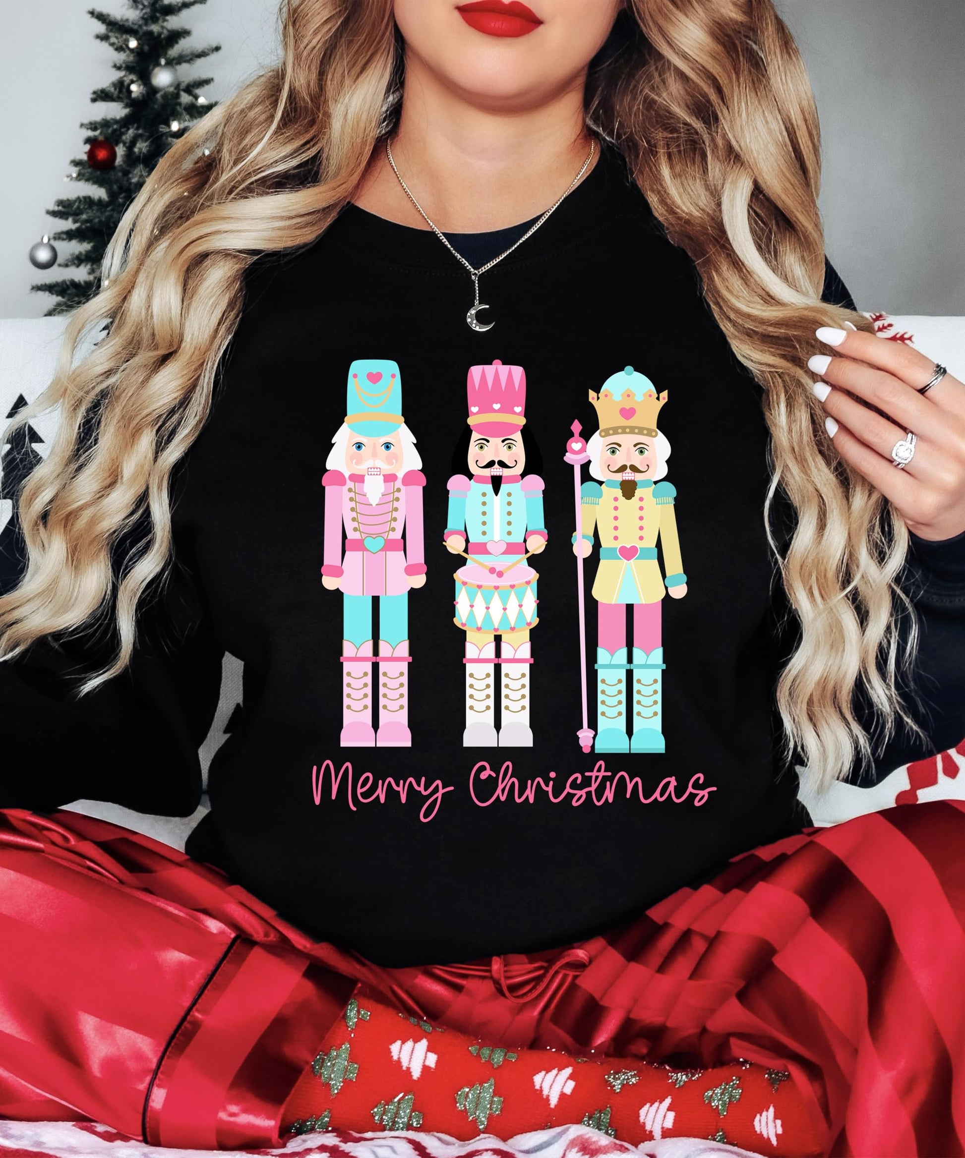 Christmas themed pullover with adorable pastel nutcracker illustration and holiday greetings
