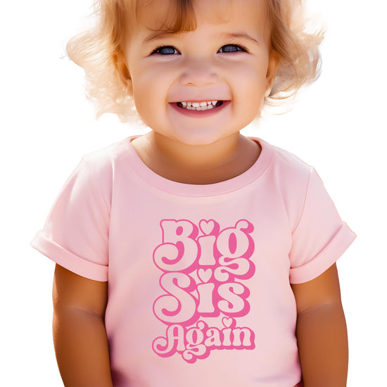 Big Sis Again kids shirt natural color with playful groovy typography