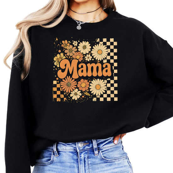 Women's black crewneck sweatshirt with retro checkered and orange daisy floral mama graphic on front
