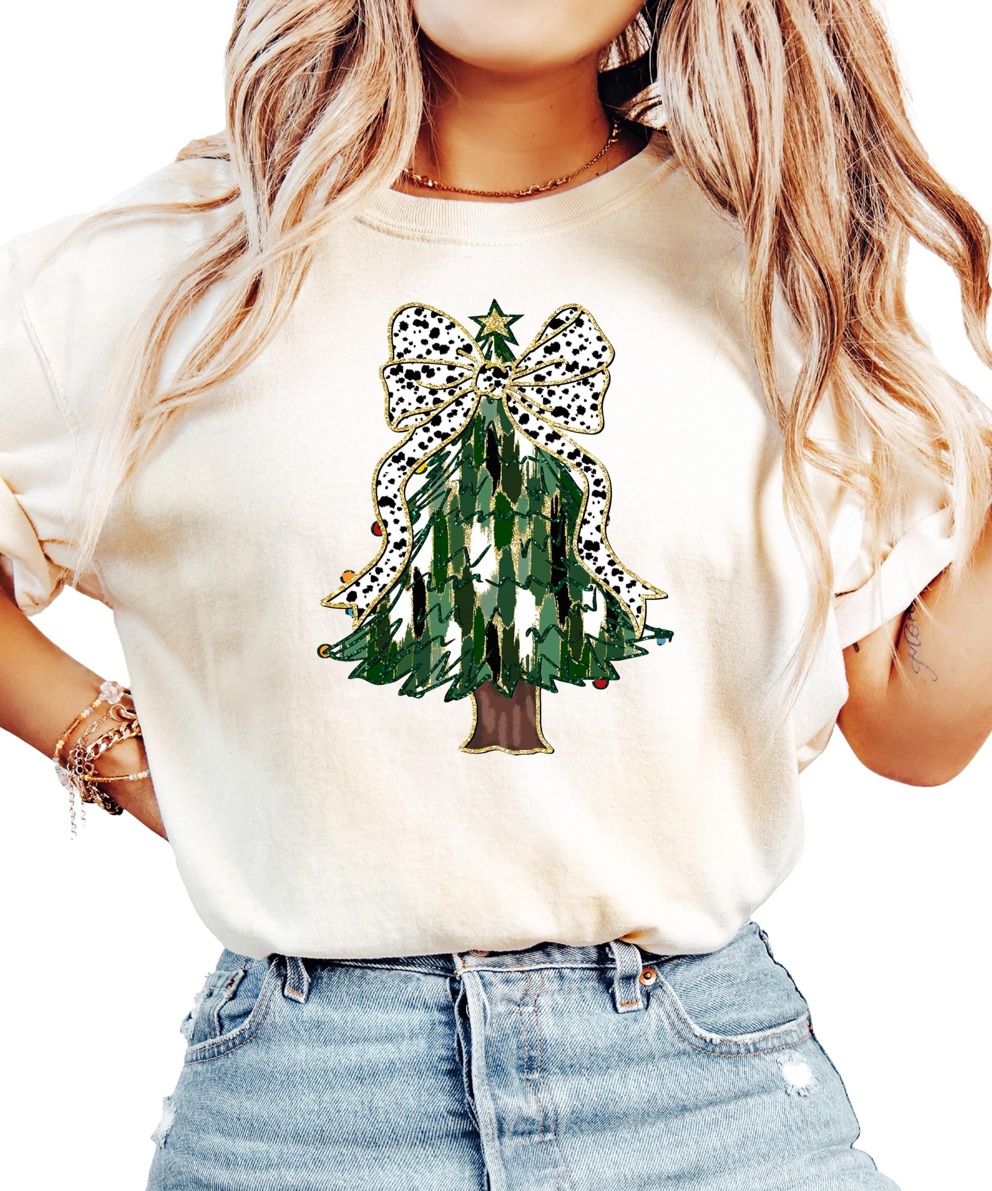 Flat lay or styled shot of ivory women's holiday graphic tee with Christmas tree and gold star topper