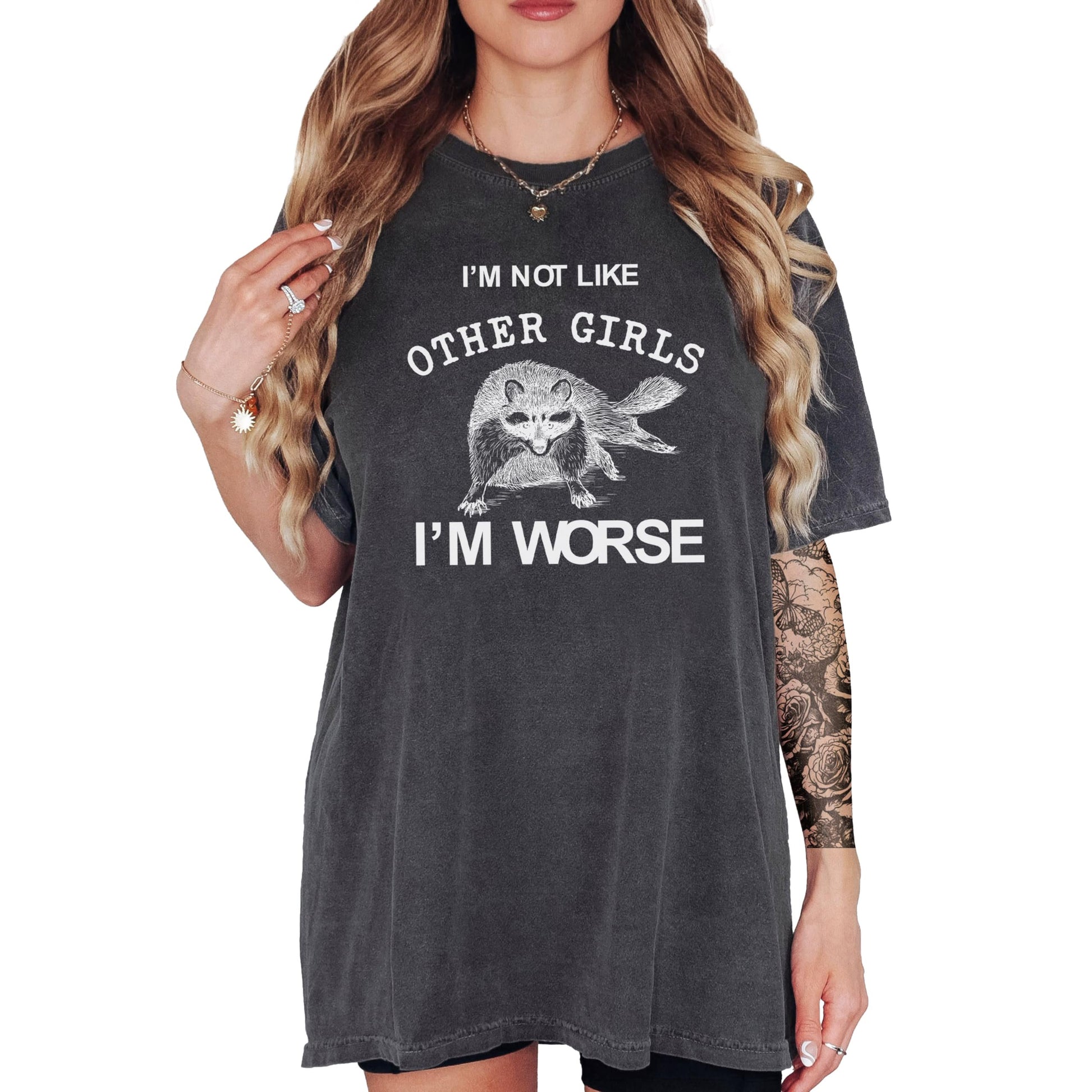 Close-up of raccoon graphic and 'I'm Not Like Other Girls I'm Worse' print on ivory tee