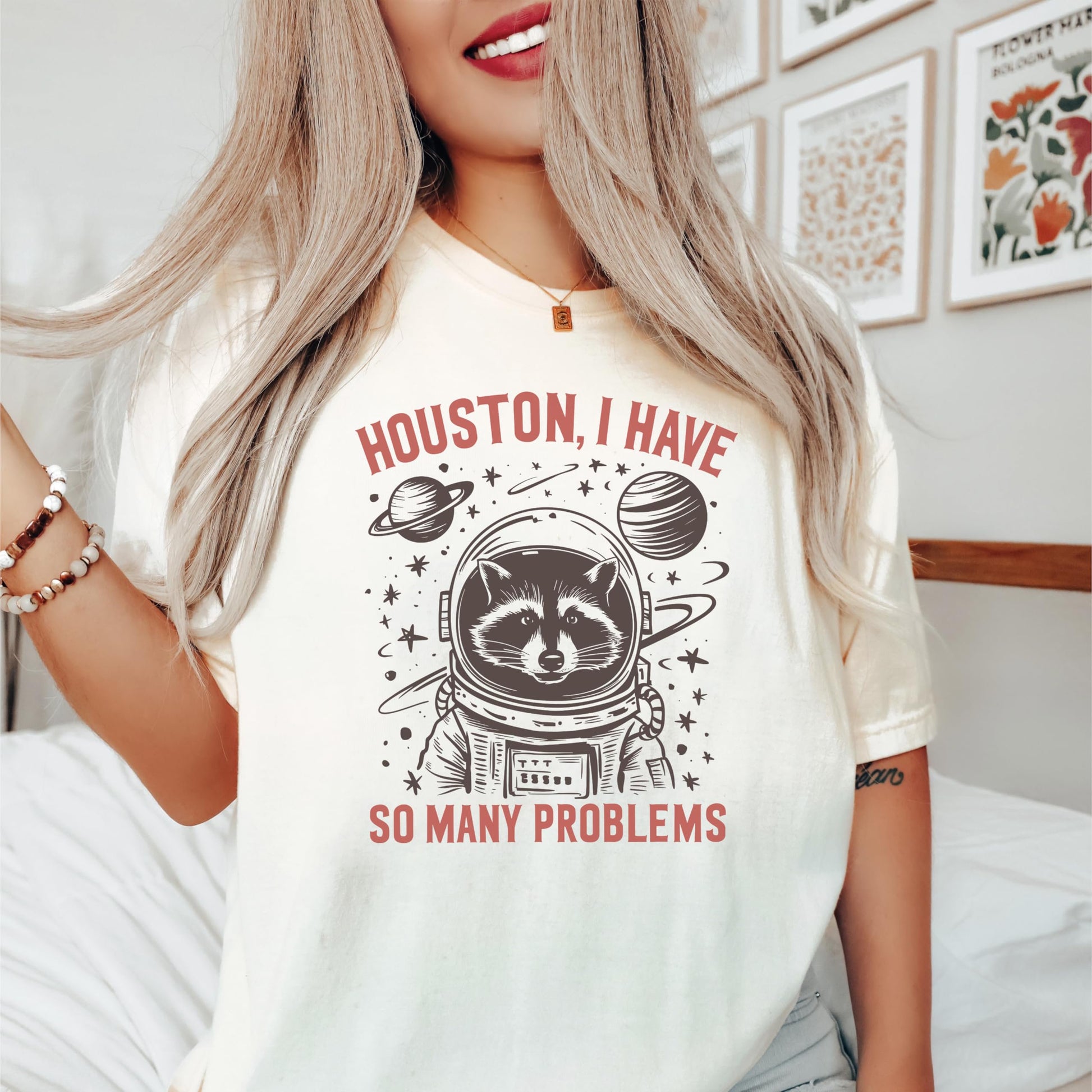 Side or lifestyle view of Houston I Have So Many Problems raccoon graphic tee in seafoam