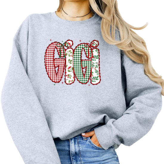 Gigi holiday sweatshirt featuring red and green lace-print festive graphic design