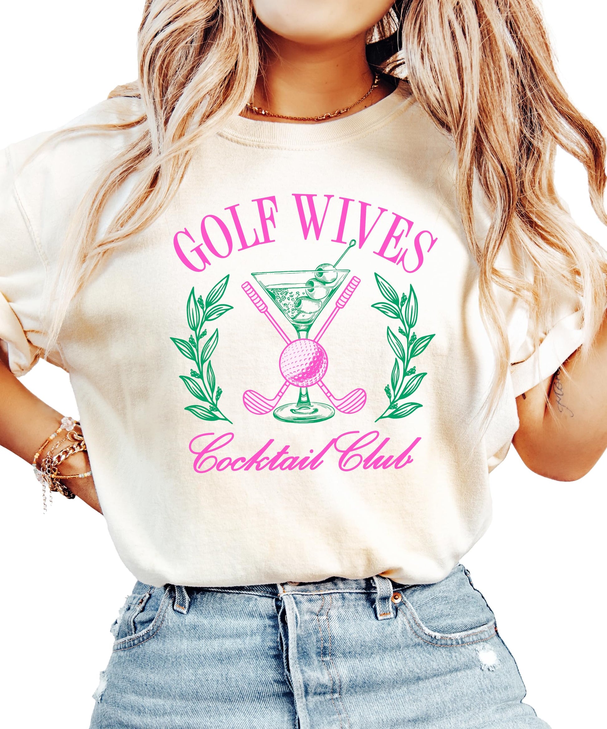 Ivory women's t-shirt with a funny Golf Wives Cocktail Club graphic featuring a dirty martini and crossed golf clubs