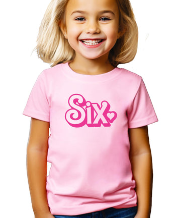 Front view of pink Six birthday shirt for girls with fun groovy lettering and heart accent
