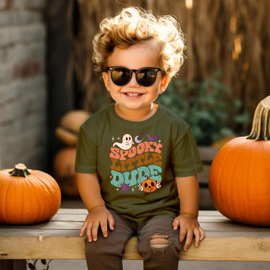 Toddler boy wearing Spooky Little Dude Halloween graphic shirt in natural color