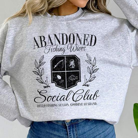 Back or lifestyle view of Abandoned Fishing Wives Social Club women's sweatshirt