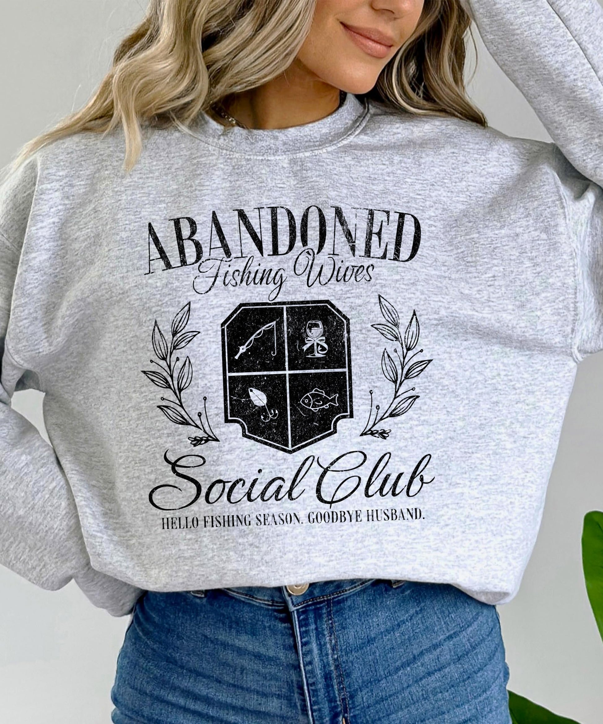 Back or lifestyle view of Abandoned Fishing Wives Social Club women's sweatshirt