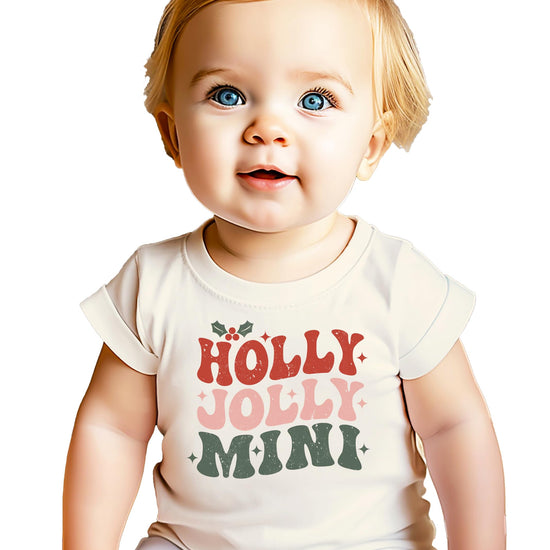 Flat lay of Holly Jolly Mistletoe matching family Christmas tee in natural color