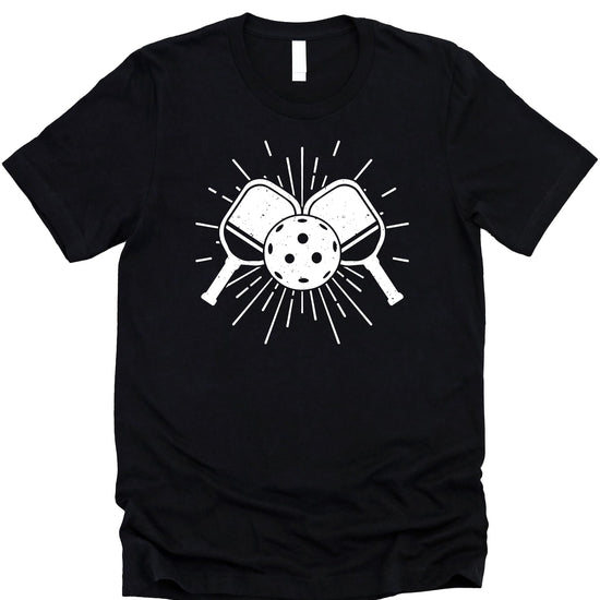 Close-up of pickleball paddle and ball graphic print on black sports tee