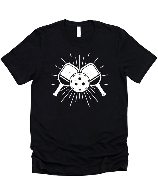 Close-up of pickleball paddle and ball graphic print on black sports tee