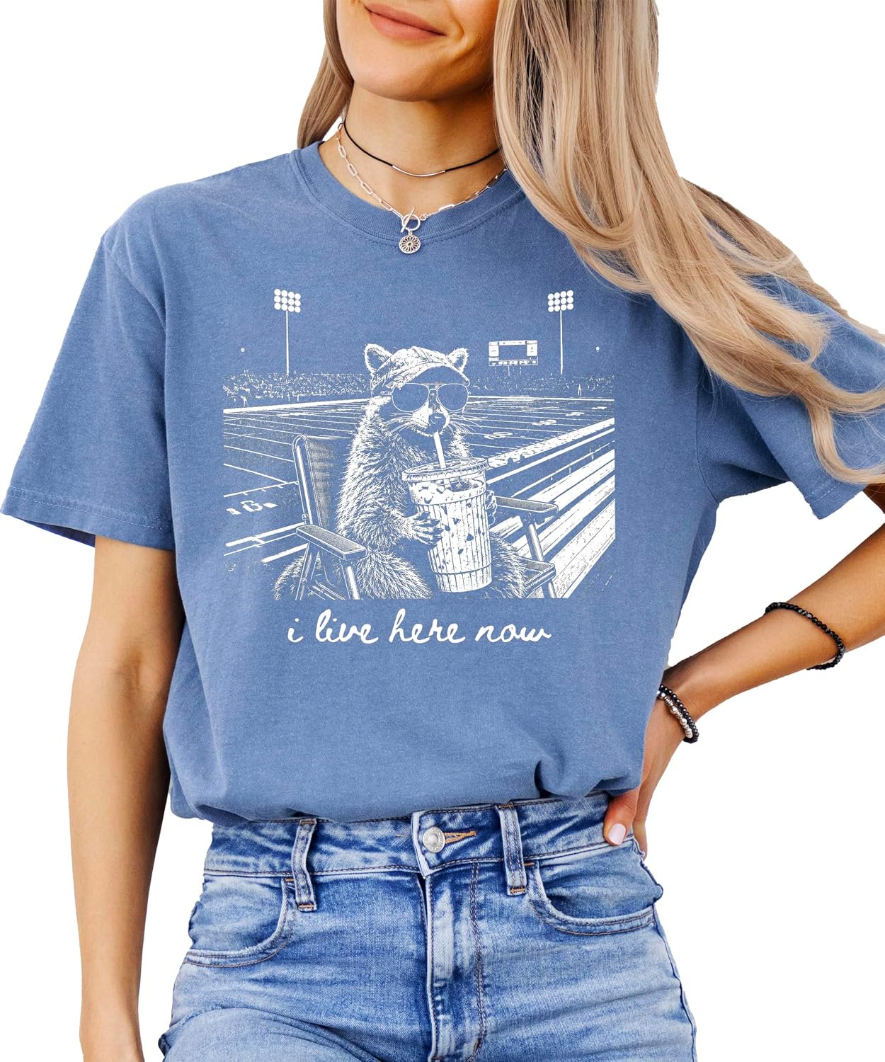 Back or alternate view of I Live Here Now raccoon football tee showing garment-dyed color and fit