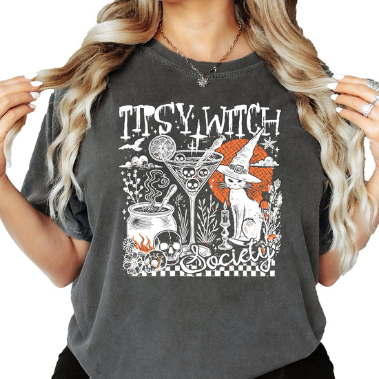 Tipsy Witch Society Halloween tee laid flat showing full front graphic print on black fabric