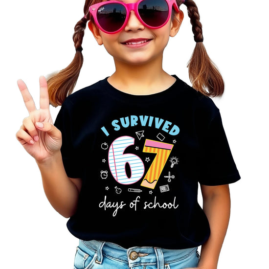 Youth graphic tee with humorous 67 days of school milestone design, laid flat