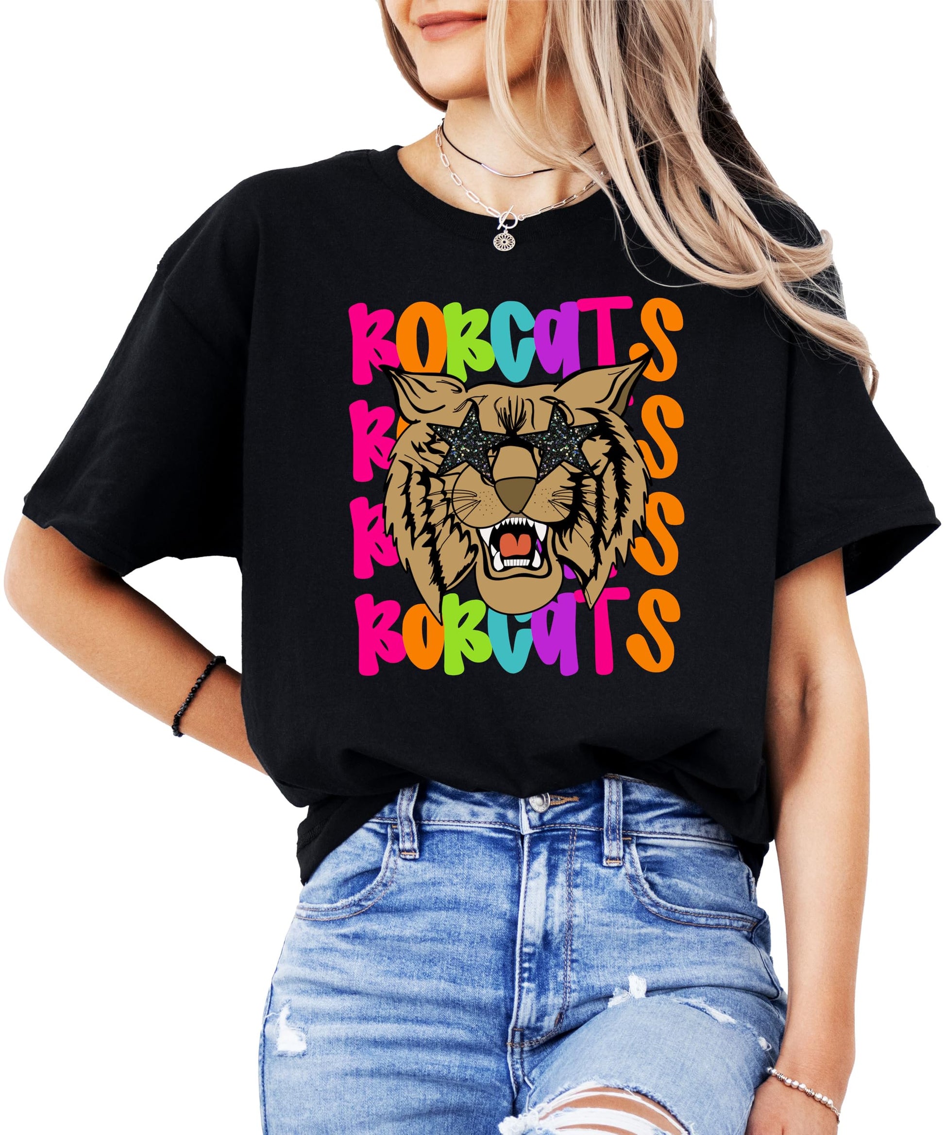 Adult woman wearing colorful Bobcats school spirit tee in natural color