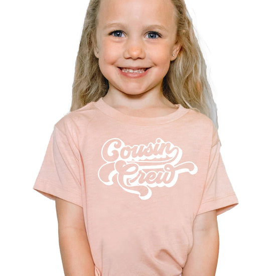 Cousin crew matching family shirts displayed in various colors and sizes