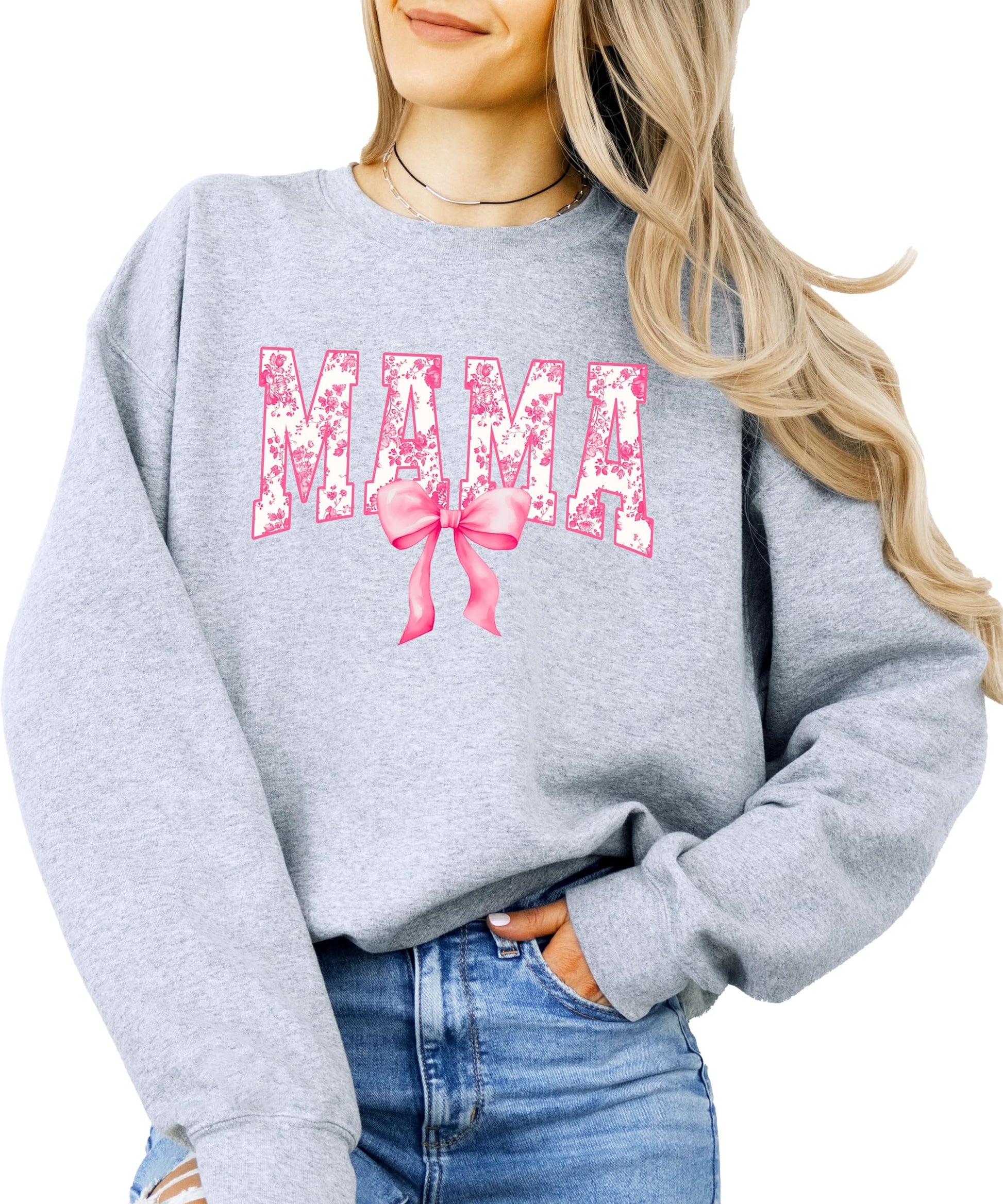 Close-up of pink bow MAMA graphic on black sweatshirt for women