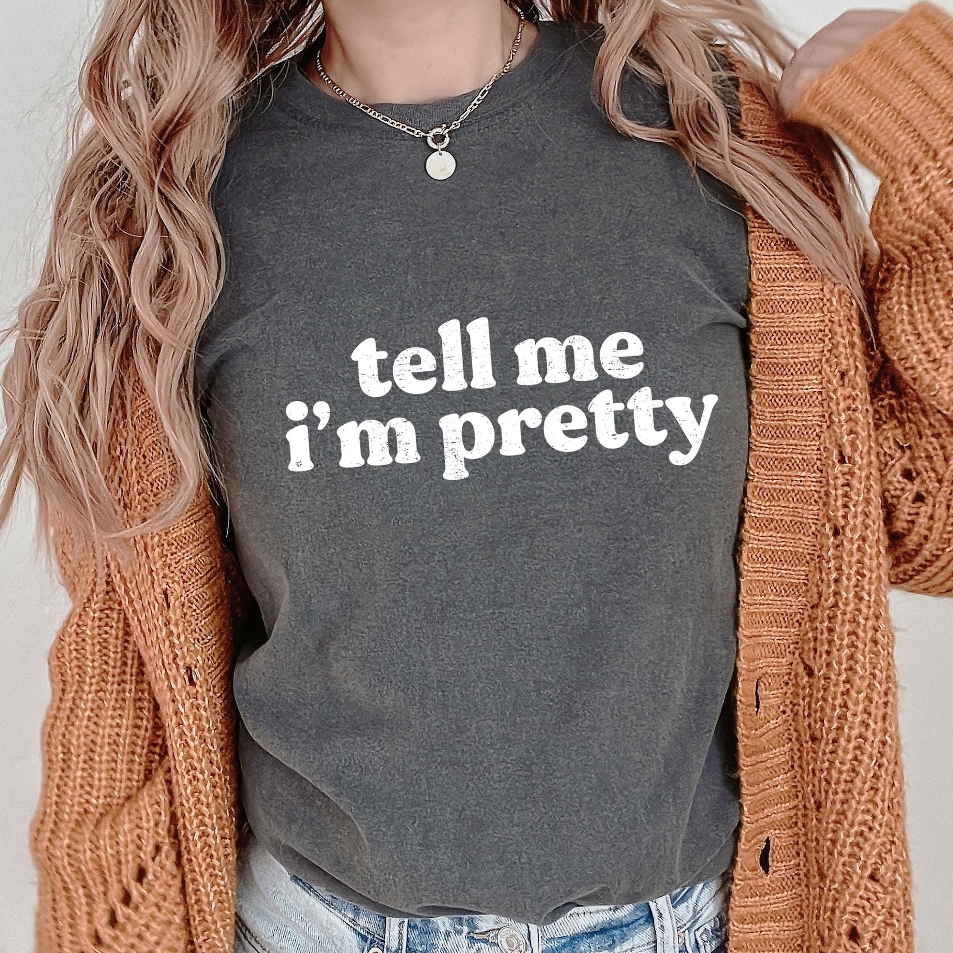 Tell Me I'm Pretty ivory graphic tee laid flat, full product view