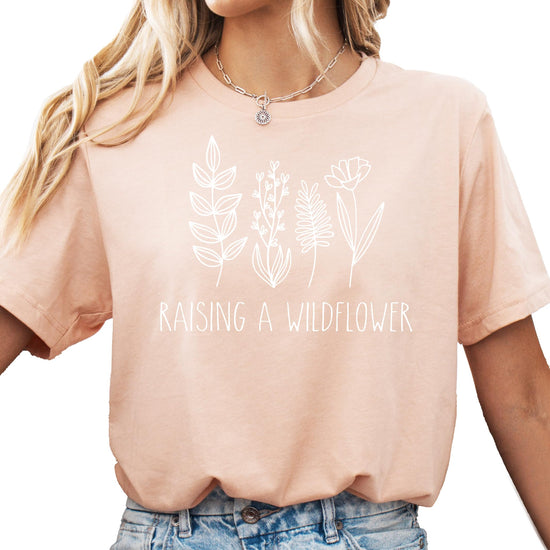 Mommy and me raising wildflowers matching mauve shirts with white graphic print