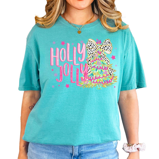 Close-up of vibrant colorful Christmas tree with bow print on Holly Jolly women's holiday tee