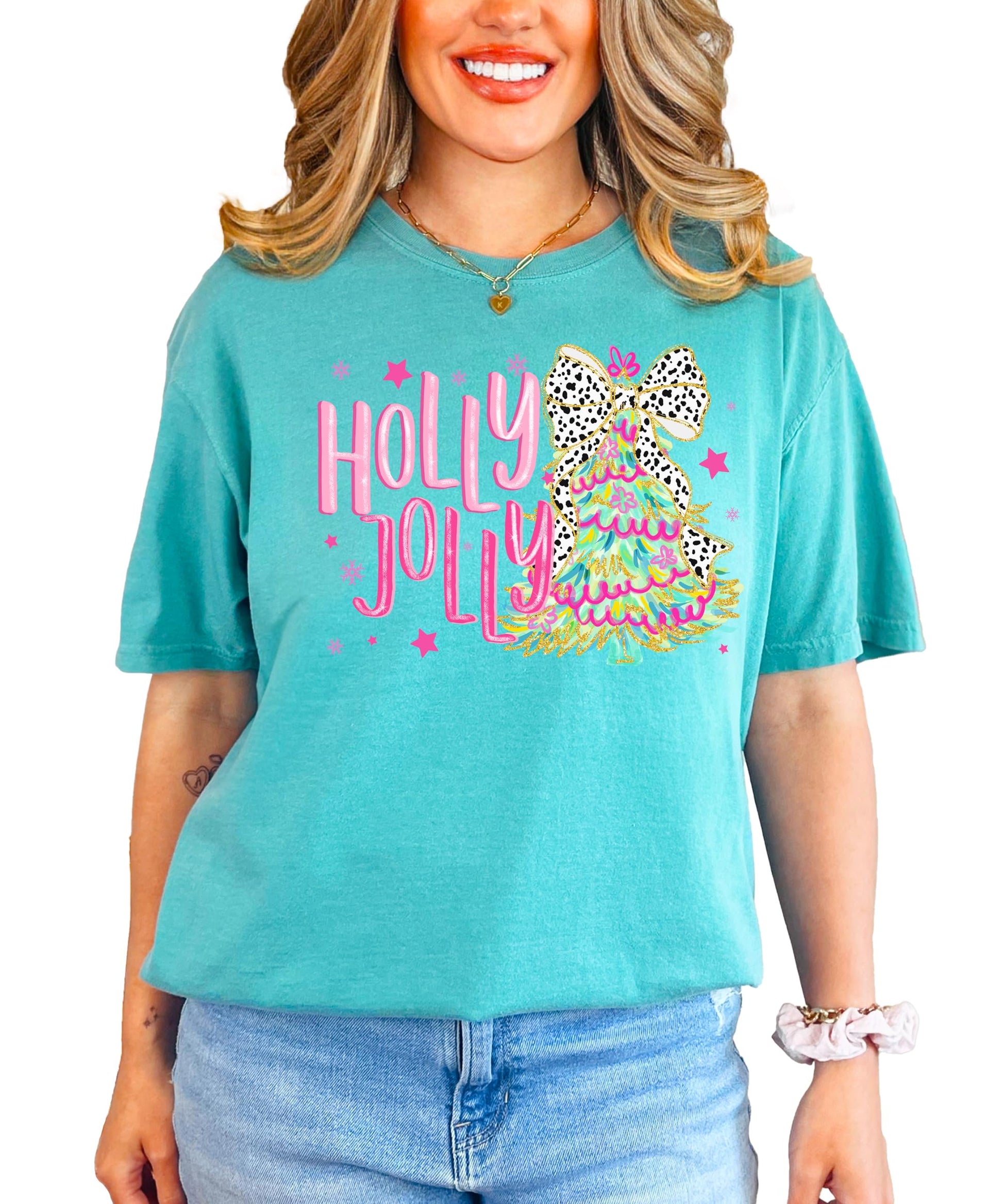 Close-up of vibrant colorful Christmas tree with bow print on Holly Jolly women's holiday tee