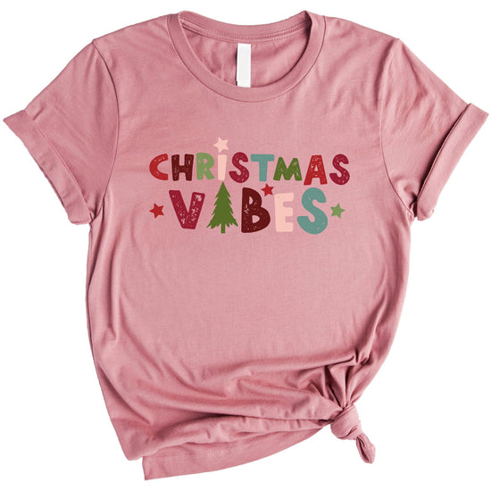 Close-up of Christmas tree graphic print on mauve holiday matching t-shirt
