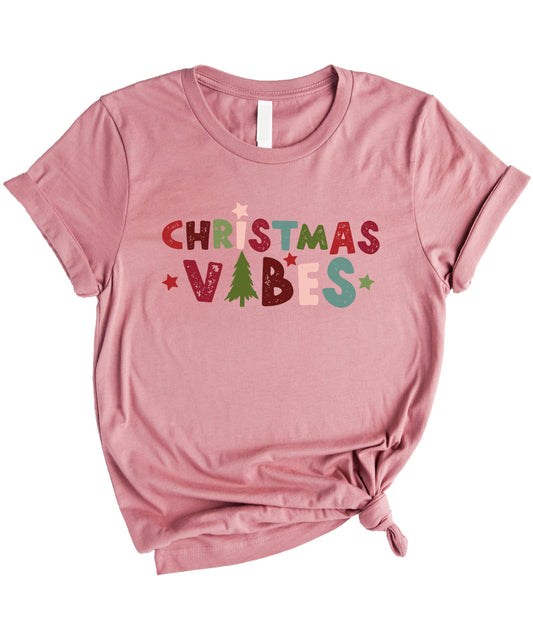 Close-up of Christmas tree graphic print on mauve holiday matching t-shirt