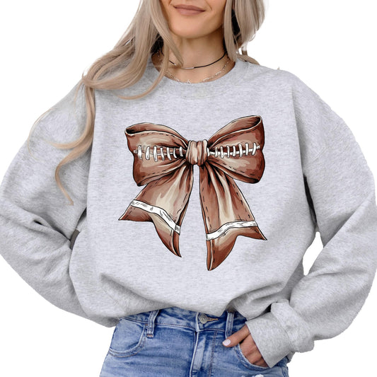 Front view of Football Coquette Bow Sweatshirt with ribbon detail on white fabric
