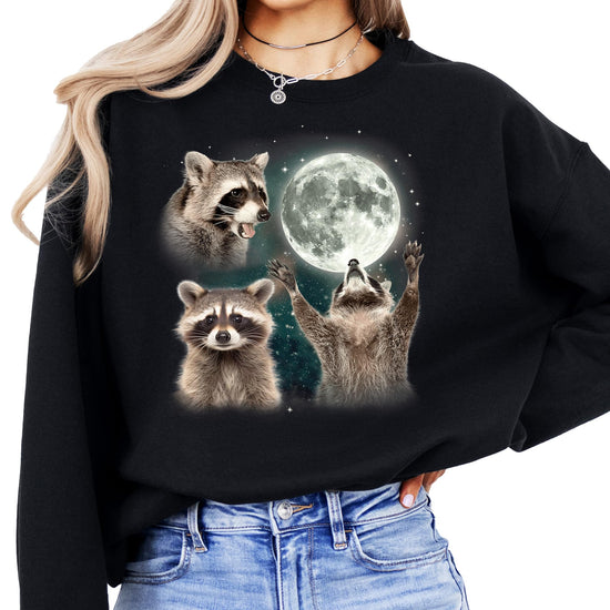 Women's gray pullover sweatshirt with vintage-style funny raccoon howling at the moon graphic