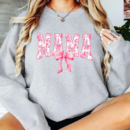 Back view of black Mama graphic sweatshirt on woman