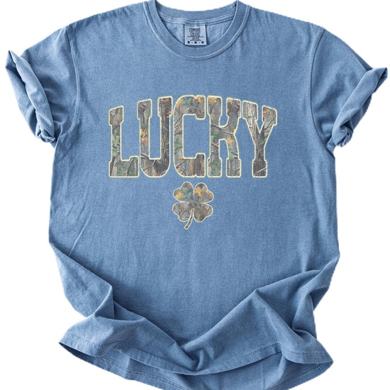 Unisex St. Patrick's Day lucky camo graphic tee with oversized block lettering and shamrock clover design